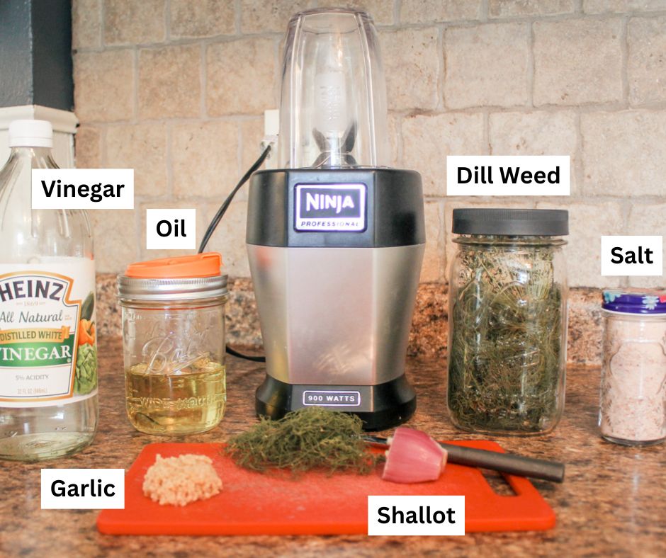 ingredients to make salad dressing sit on a kitchen counter