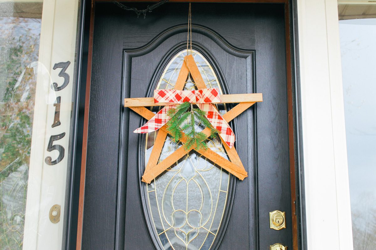 front door of a house displays finished Christmas star