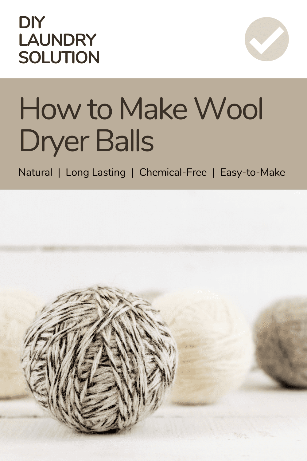 diy dryer balls lined up on a white wooden surface