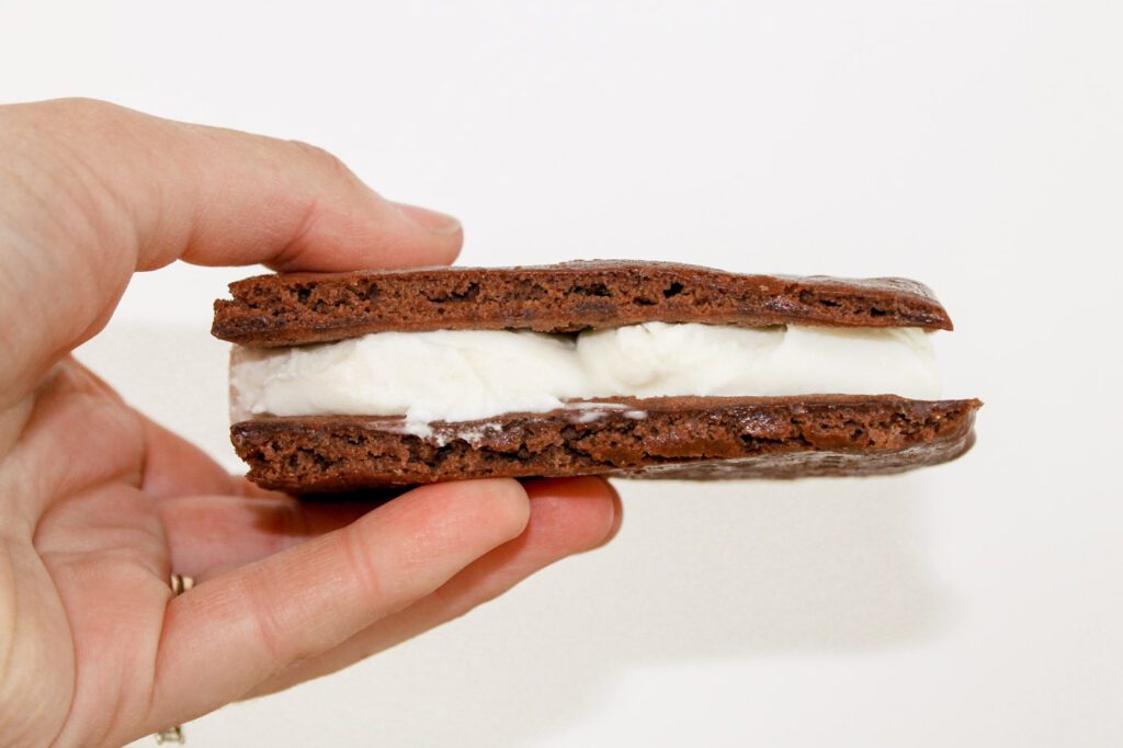 woman holding an ice cream sandwich