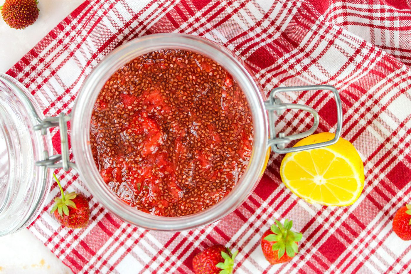 top down view of glass jar filled with strawberry chia seed jam
