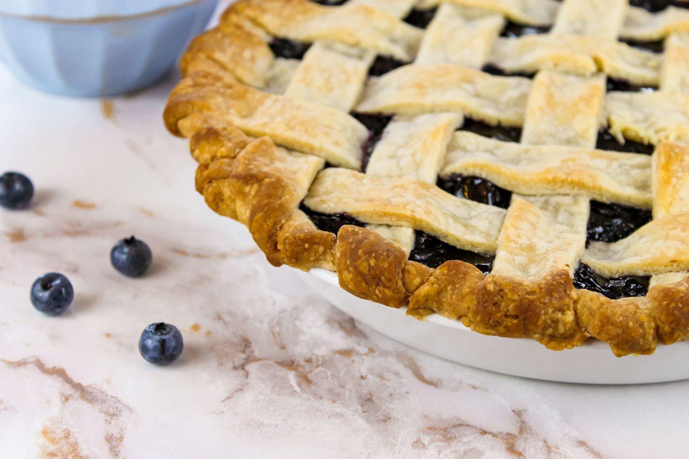 close up photo of blueberry pie with lattice crust