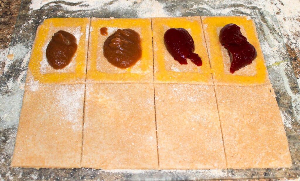 cutting homemade pie crust into rectangles to create pop tarts