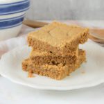 plate with 3 peanut butter cookie bars stacked on top of each other