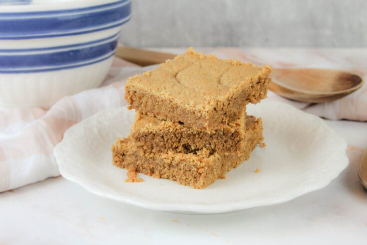 plate with 3 peanut butter cookie bars stacked on top of each other