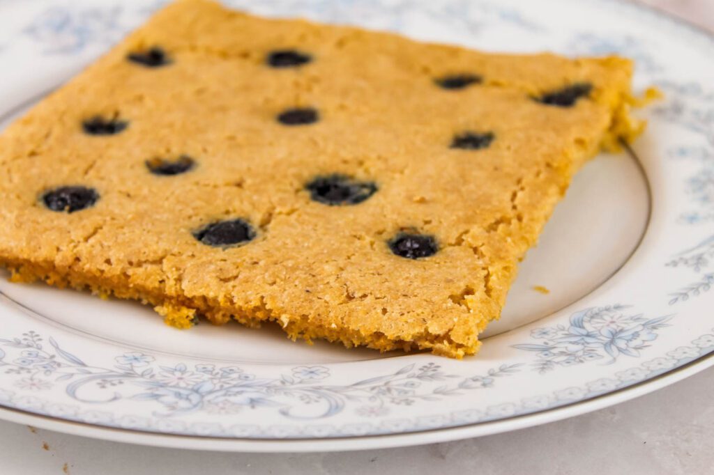 plate with a slice of blueberry pancake