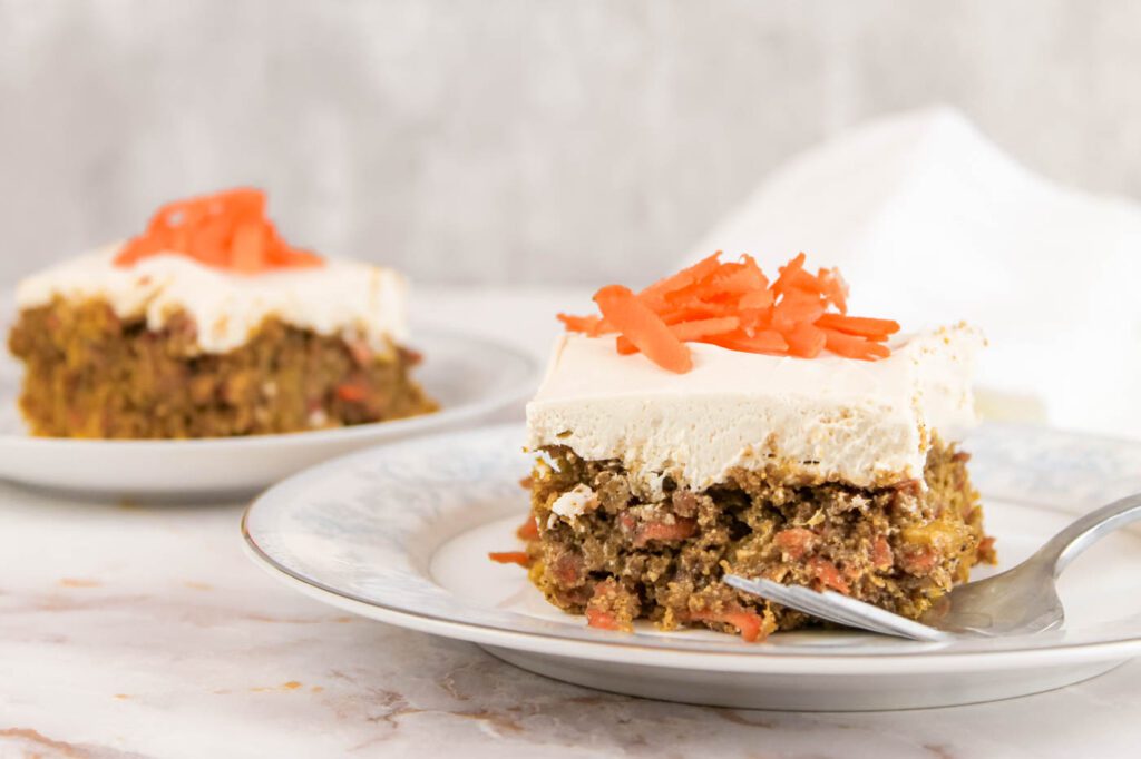 multiple slices of cake sit on a kitchen countertop. one slice faces the front and has a fork on the plate.