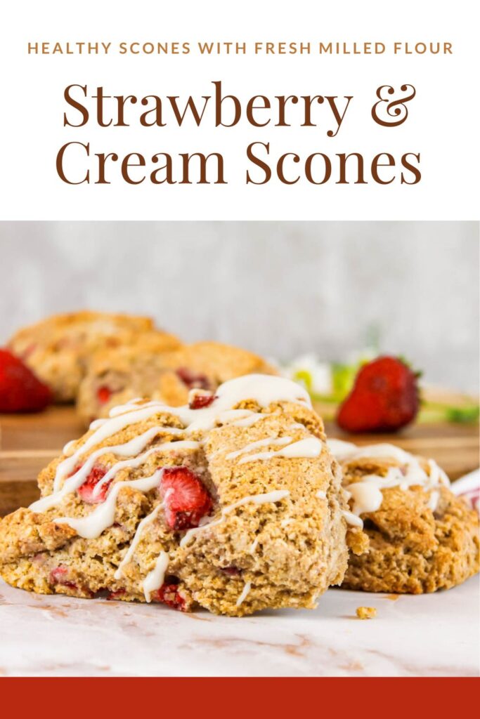 pinterest graphic displaying glazed scones on a marble kitchen top beside fresh strawberries