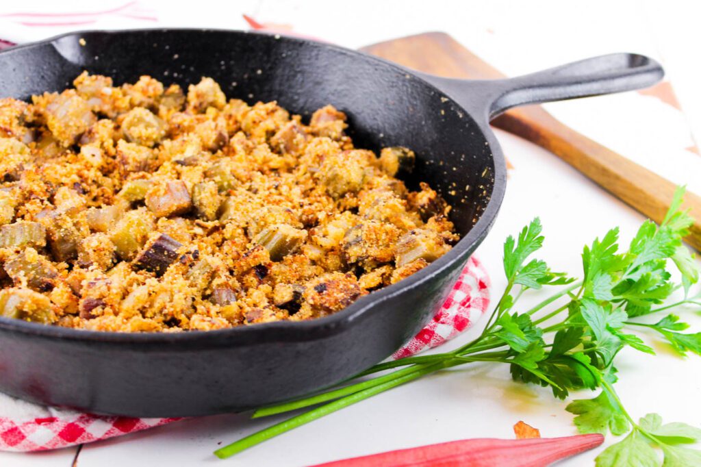 cast iron skillet filled with pan fried okra with fresh milled flour