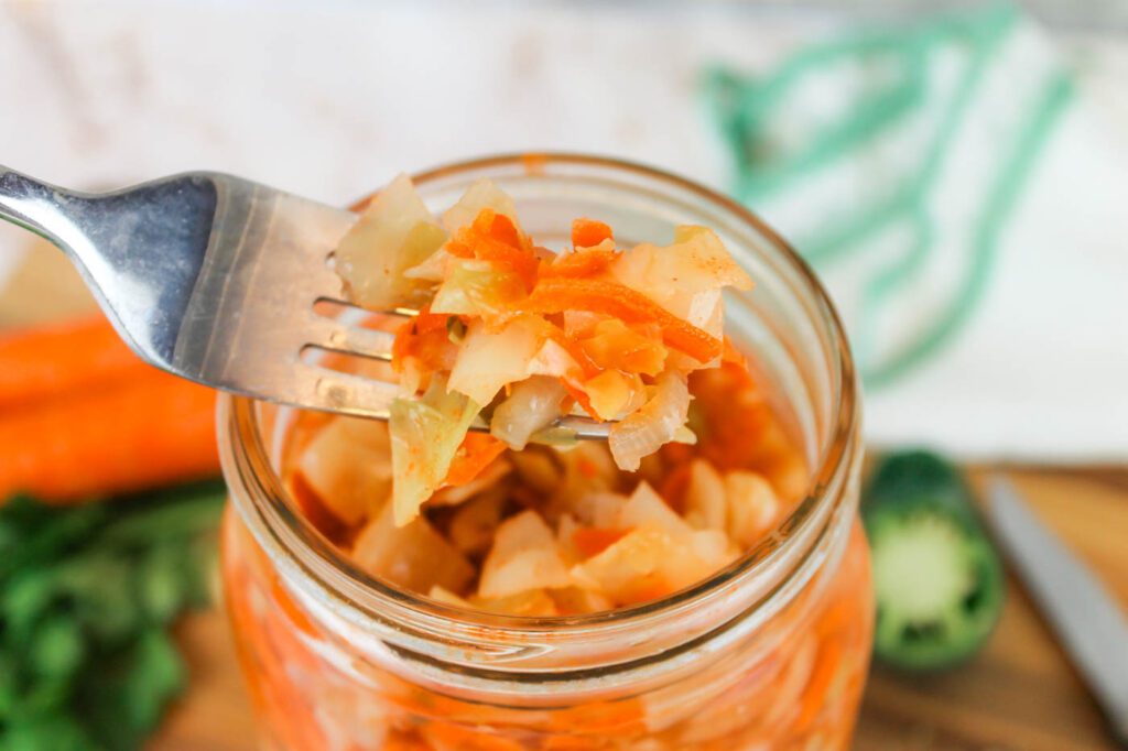 a fork filled with fermented curtido recipe