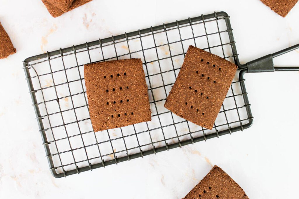 two chocolate crackers cooling on a wire rack