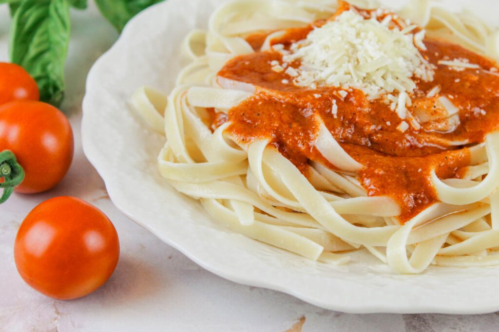 pasta covered in tomato sauce and parmesan