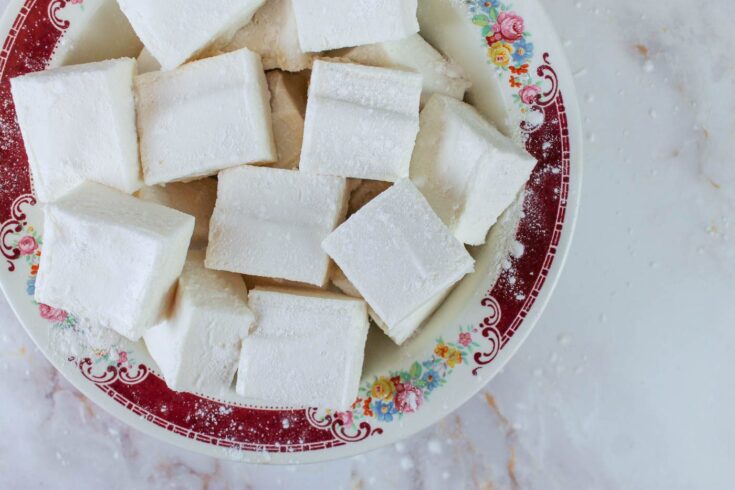 a red floral bowl filled with healthy homemade marshmallows