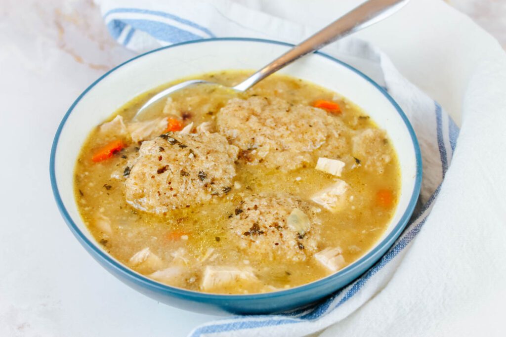 blue bowl with chicken and dumplings