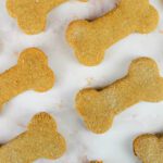 multiple rows of homemade dog treats with fresh milled flour laying on the countertop
