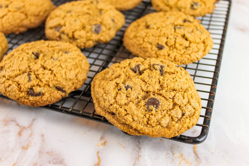 close up of cookies sitting on a cooling rack