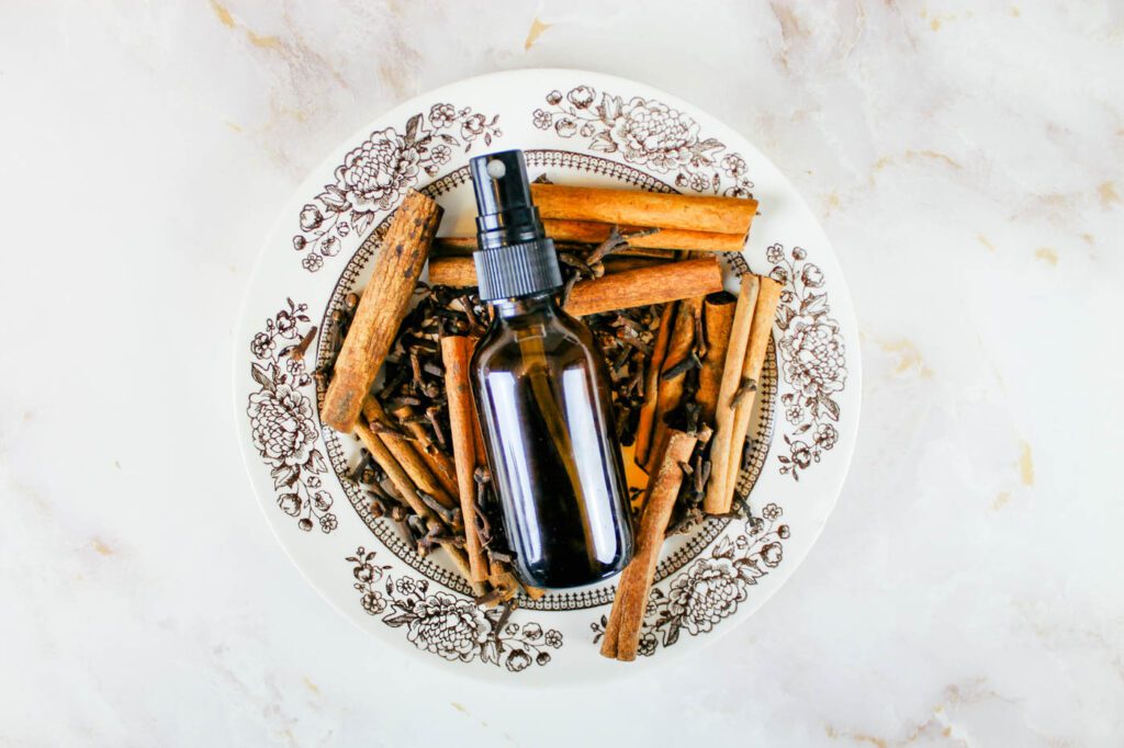 plate of dried spices with a spray bottle of air freshener on top