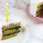 a slice of cake with a diy beeswax birthday candle on top