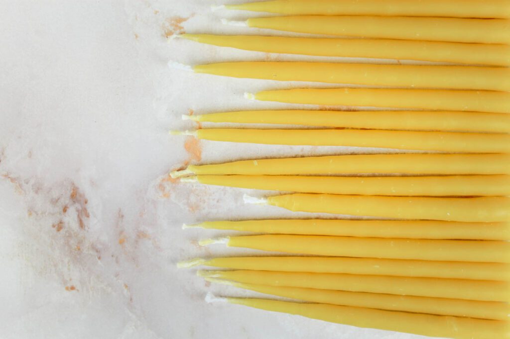 a pile of birthday candles laying on the countertop