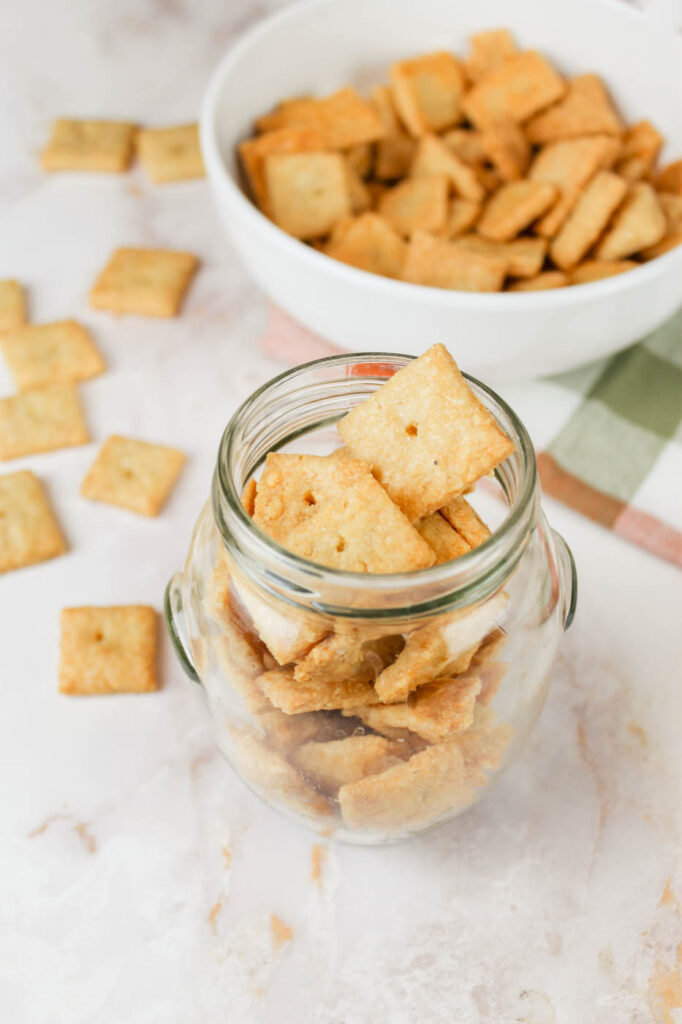 jar of cheese crackers on a marble countertop